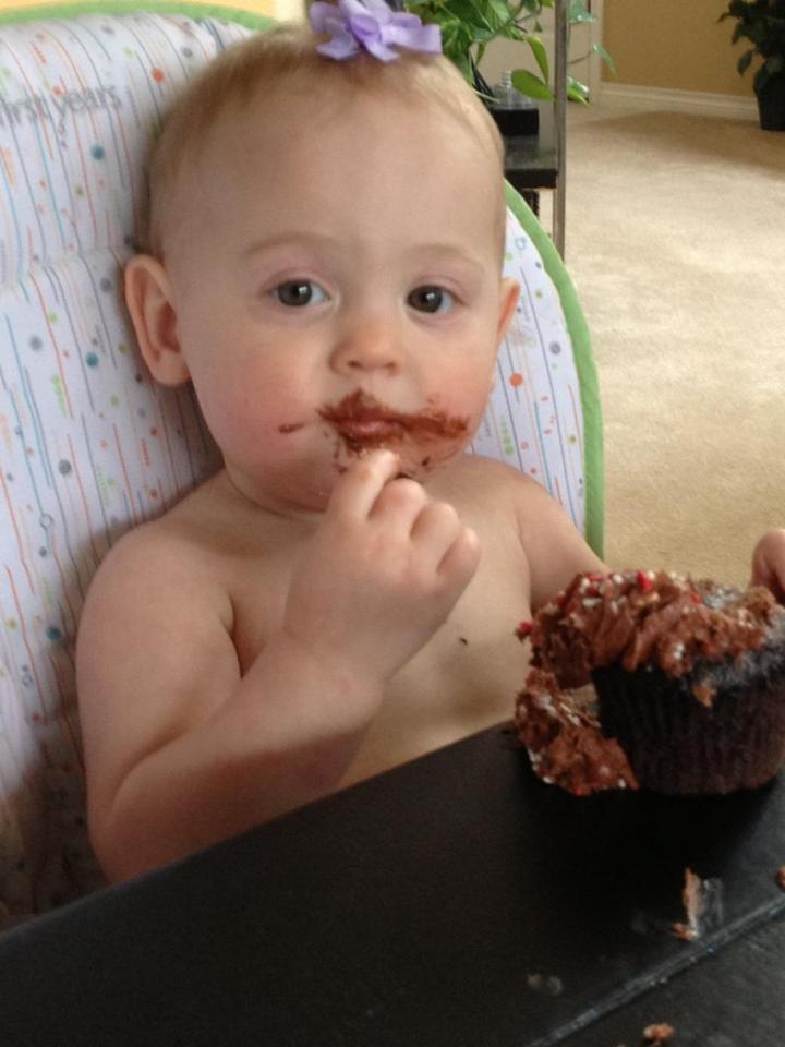 Isla eating a cupcake