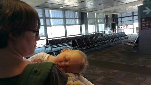 Isla napping in the Ergo at airport