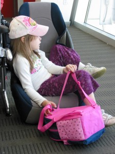 Girl in Car Seat in Airport