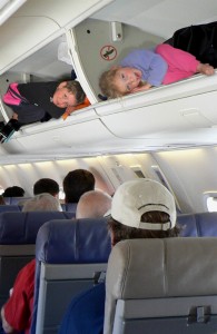 Kids in plane overhead bins