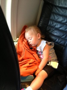 Isla sleeping on the plane